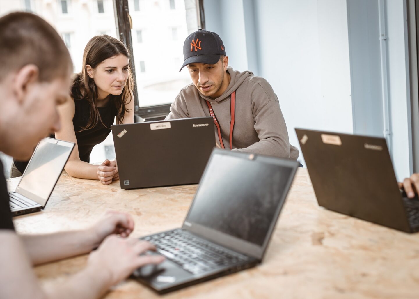 Illustrative picture showing a man helping a woman on a computer